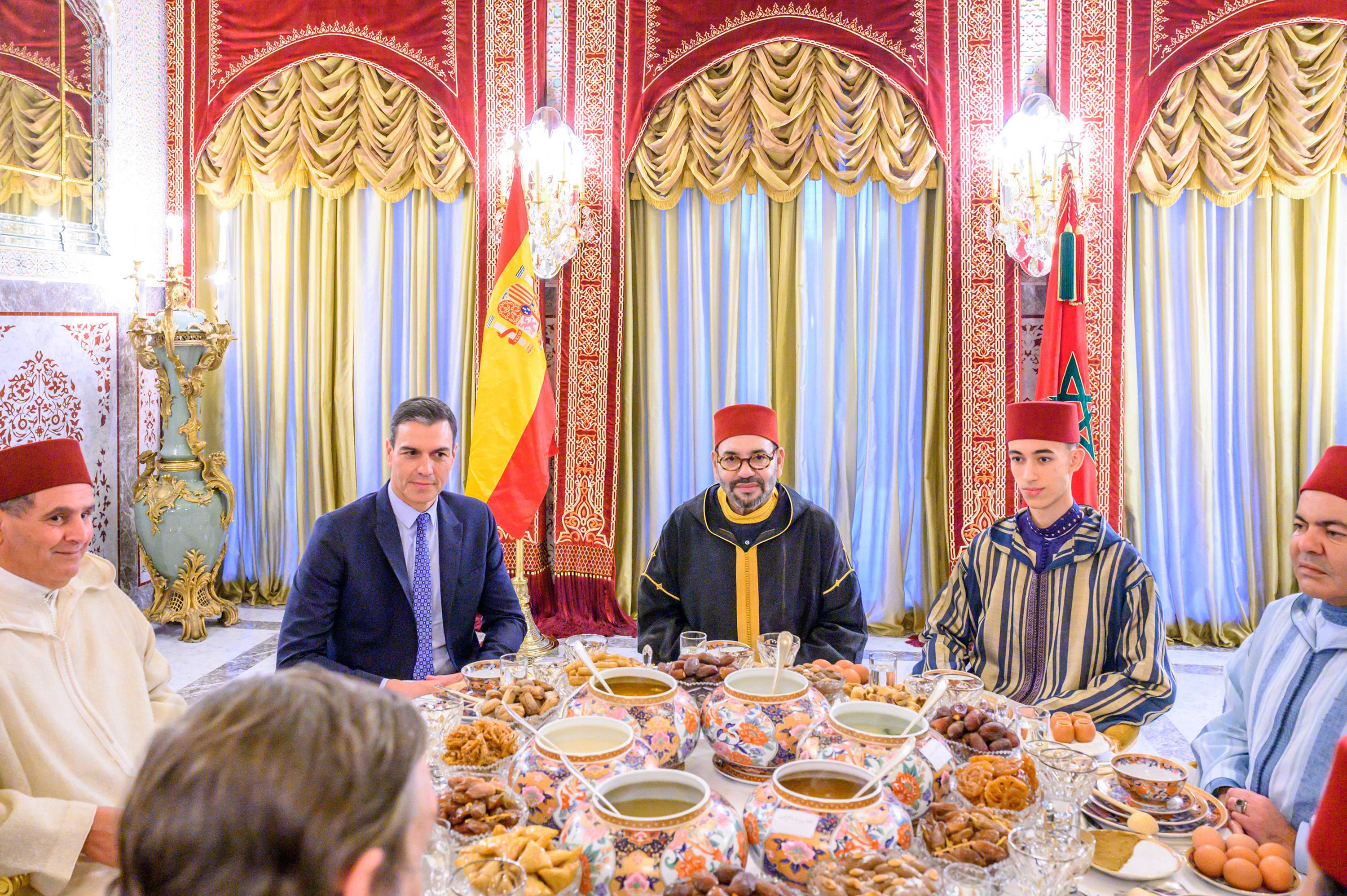In this photo provided by the Royal Palace, Moroccan King Mohammed VI, center, Spanish Prime Minister Pedro Sánchez, second left, Crown Prince Moulay Hassan, second right, Prince Moulay Rachid, brother of the king , right, and Moroccan Prime Minister Aziz Akhannouch, left, pose before an Iftar meal, the dinner at which Muslims end their daily Ramadan fast at sunset, at the king's royal residence in Sale, Morocco , Thursday, April 7, 2022.